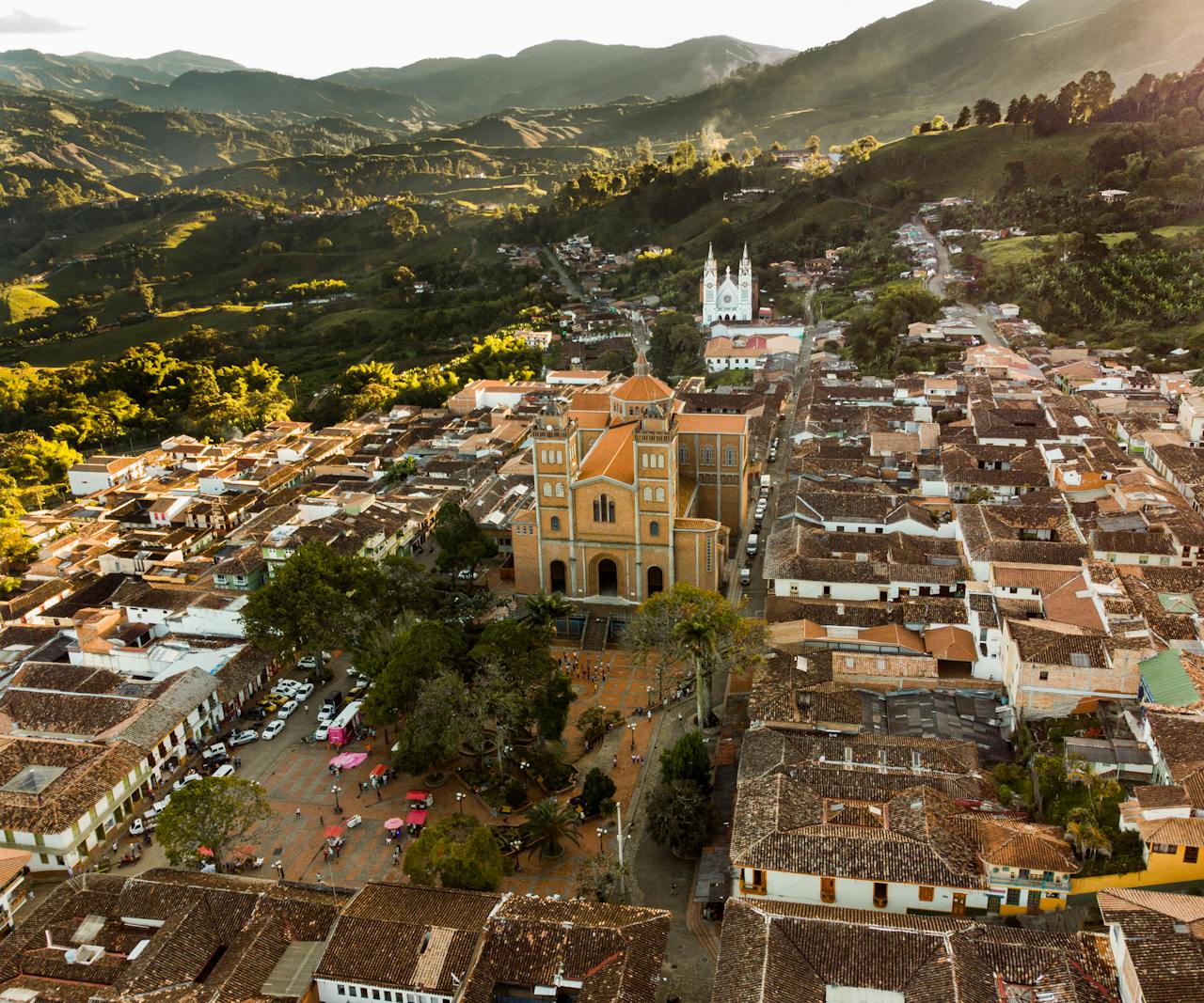 Explore a picturesque Colombian town surrounded by lush mountains and historic architecture.